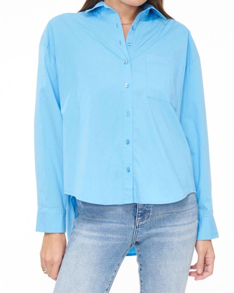 Front of a model wearing a size L Sloane Long Sleeve Oversized Button Down Shirt in Campanula Blue in Campanula Blue by PISTOLA. | dia_product_style_image_id:340360